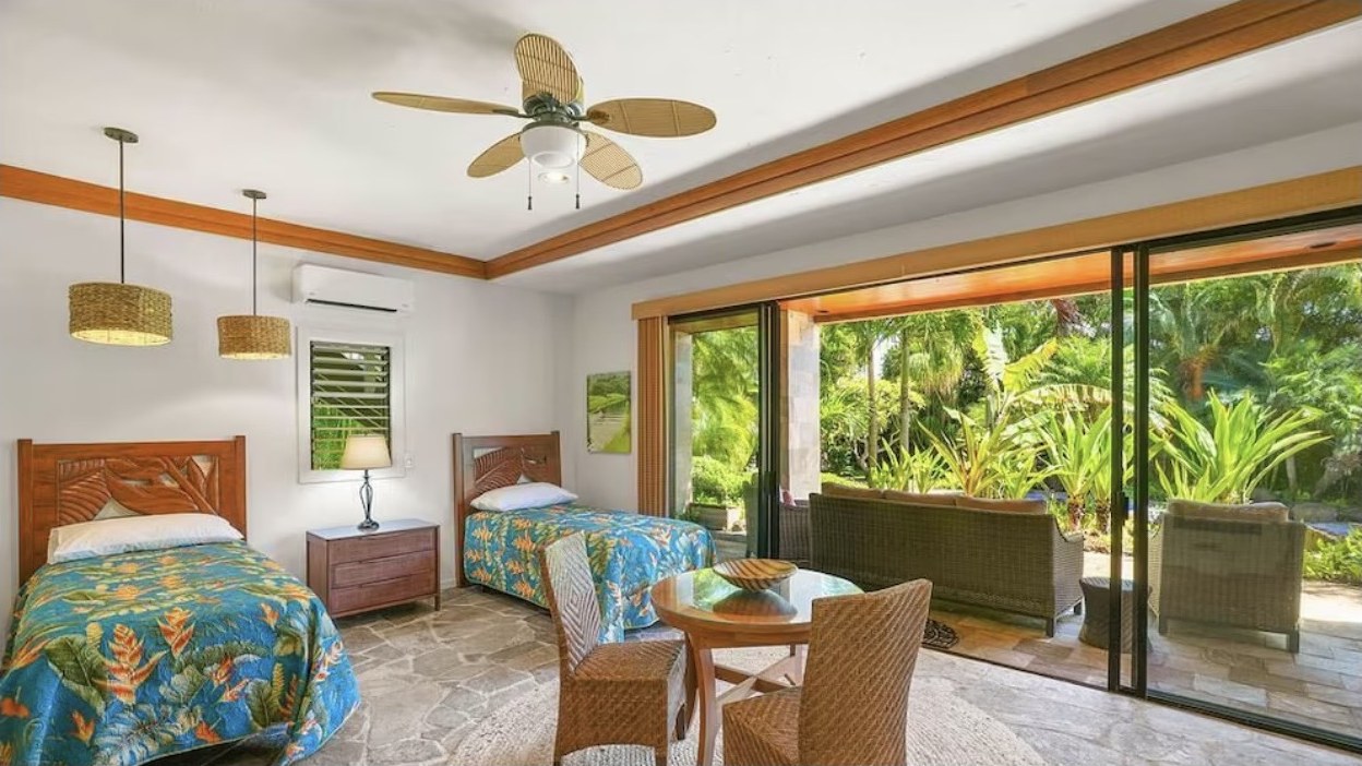 Terrace Suite, two twin beds with sliding doors onto the pool terrace
