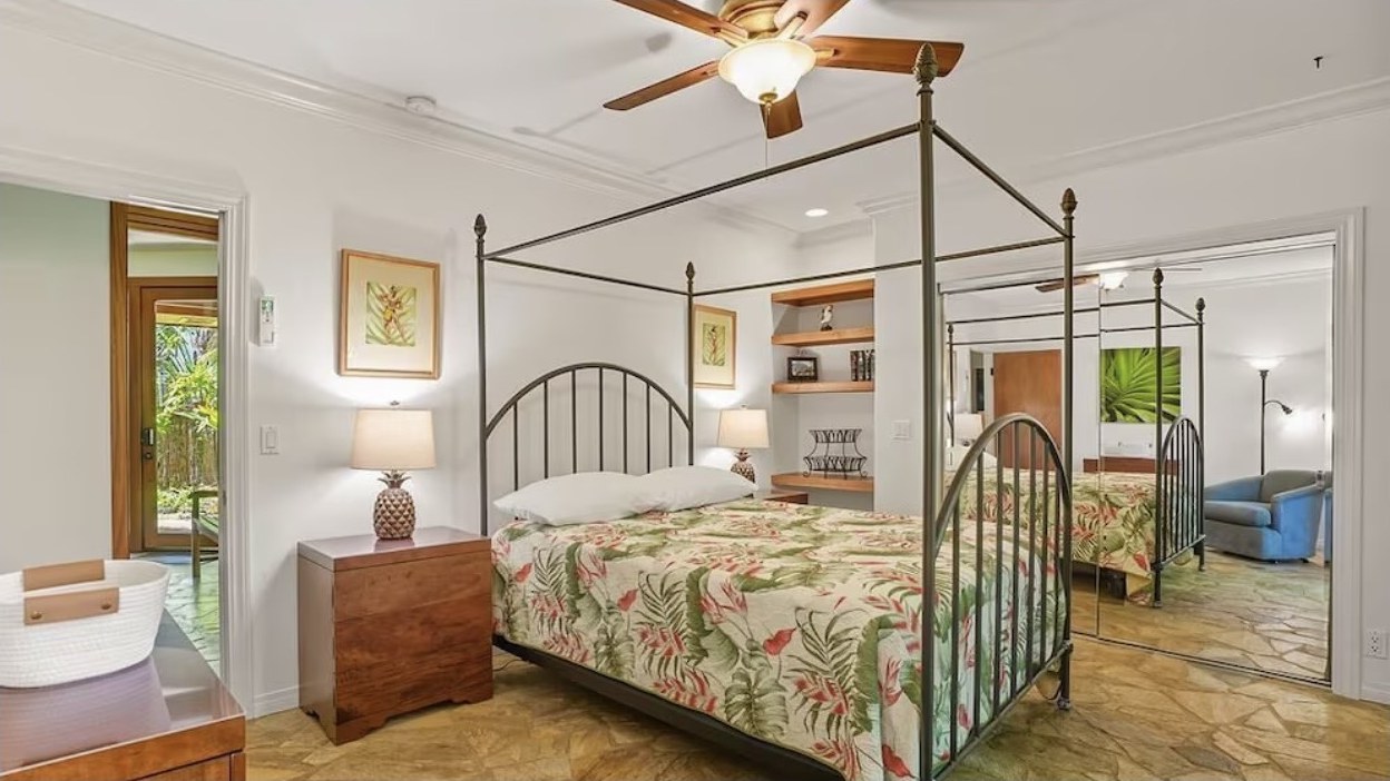 Third Bedroom, king canopy bed with sliding door to the garden